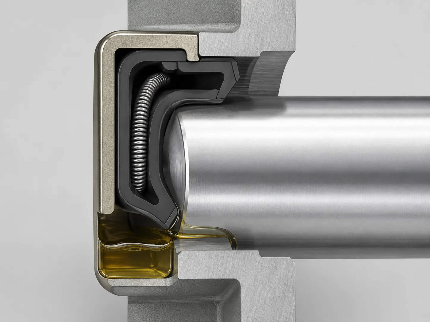 Cross-section of a rotary oil seal showing the sealing lip, spring, shaft, and housing